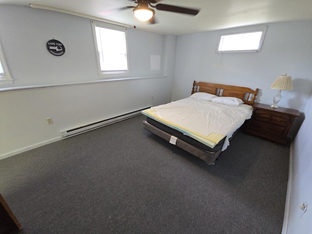 carpeted bedroom with ceiling fan and a baseboard heating unit