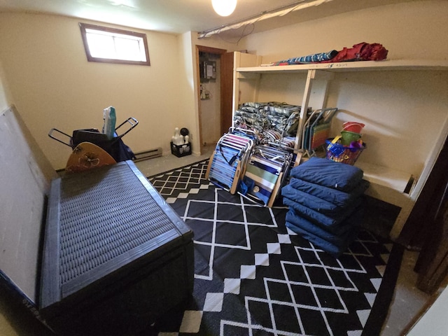bedroom with a baseboard radiator and carpet