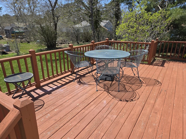 deck featuring outdoor dining area