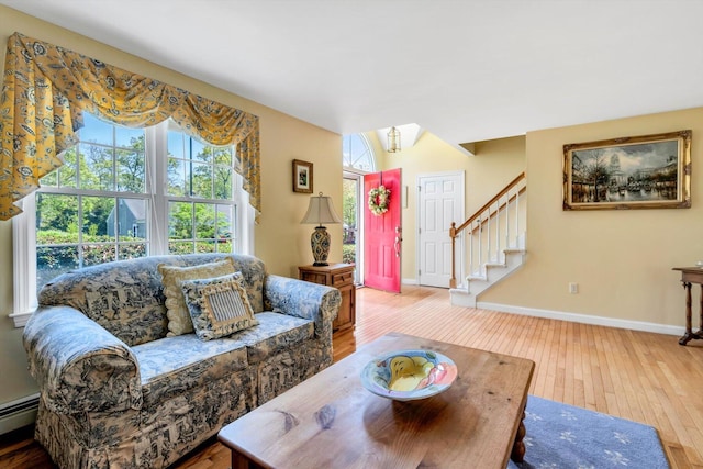 72 Rosemary Ln, Centerville, MA 02632 - living room with hardwood / wood-style floors, plenty of natural light, a baseboard radiator, and stairway