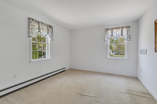 72 Rosemary Ln, Centerville, MA 02632 - spare room with a baseboard heating unit, light carpet, and baseboards