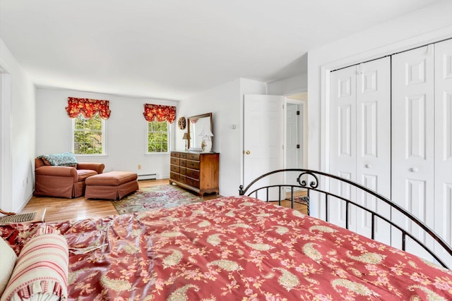 72 Rosemary Ln, Centerville, MA 02632 - bedroom featuring baseboard heating, wood finished floors, and a closet