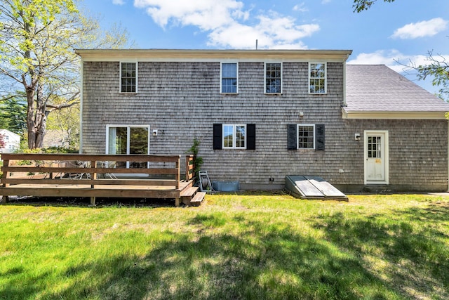 72 Rosemary Ln, Centerville, MA 02632 - rear view of property featuring a wooden deck and a lawn
