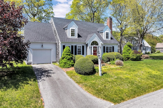 72 Rosemary Ln, Centerville, MA 02632 - cape cod-style house featuring a garage, a chimney, driveway, a front yard, and a shingled roof
