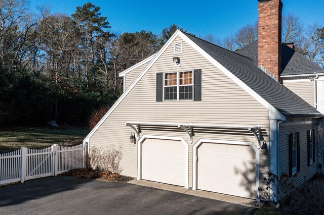 view of property exterior with a garage