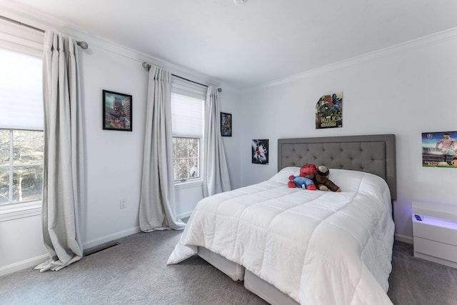 bedroom featuring dark colored carpet and ornamental molding