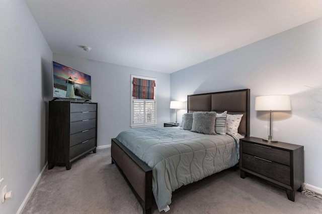 bedroom with light colored carpet