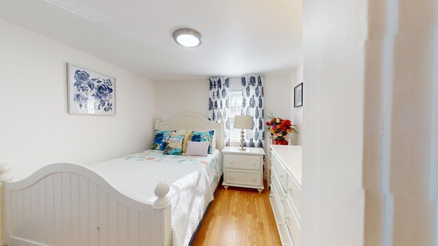 bedroom with light hardwood / wood-style floors