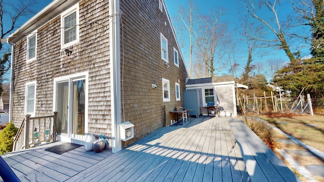 wooden deck with an outdoor structure