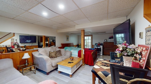 living room with a drop ceiling