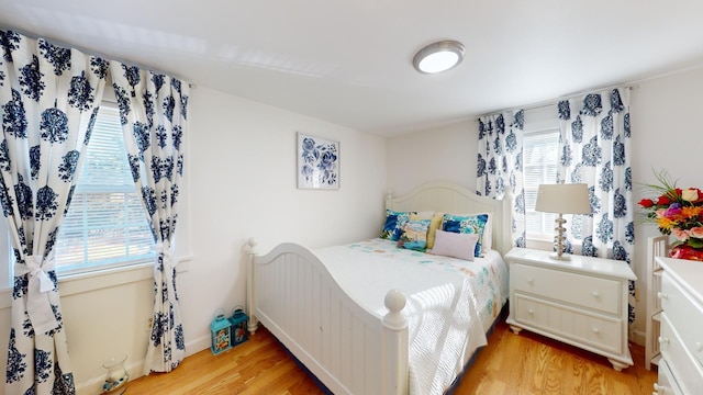 bedroom with light wood-type flooring