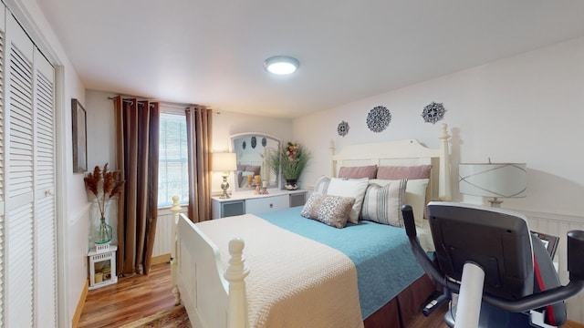 bedroom featuring light hardwood / wood-style flooring and a closet