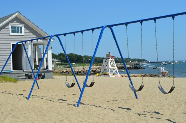 view of jungle gym with a water view