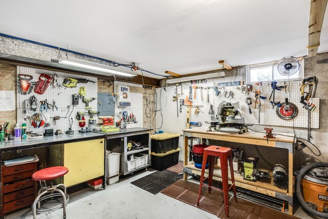 interior space with concrete flooring and electric panel