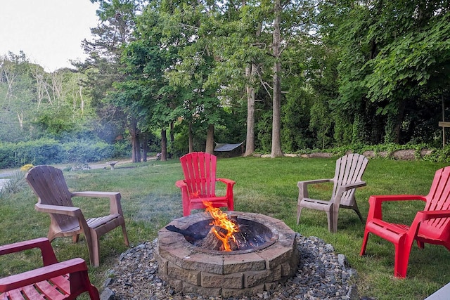 view of yard with a fire pit