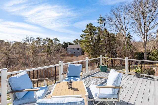 wooden terrace featuring outdoor dining space
