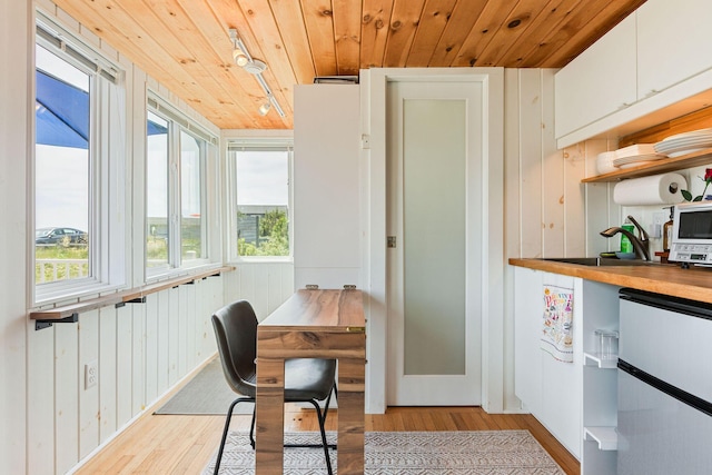 963 Commercial St Unit U30, Provincetown, MA 02657 - office with light wood finished floors, wooden ceiling, healthy amount of natural light, and wooden walls