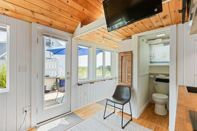 963 Commercial St Unit U30, Provincetown, MA 02657 - doorway featuring wood finished floors, healthy amount of natural light, and wood ceiling