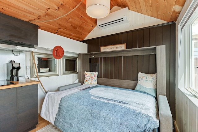 963 Commercial St Unit U30, Provincetown, MA 02657 - bedroom featuring an AC wall unit, vaulted ceiling, wood ceiling, wood walls, and wood finished floors