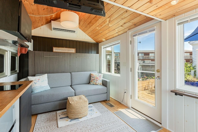 963 Commercial St Unit U30, Provincetown, MA 02657 - sunroom / solarium featuring a wall mounted air conditioner and vaulted ceiling