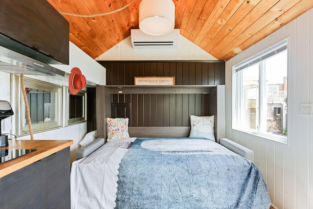 963 Commercial St Unit U30, Provincetown, MA 02657 - bedroom featuring a wall mounted air conditioner, wooden ceiling, wooden walls, and vaulted ceiling