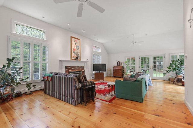 181 Pleasant St, South Yarmouth, MA 02664 - living room featuring a ceiling fan, wood-type flooring, a brick fireplace, vaulted ceiling, and french doors