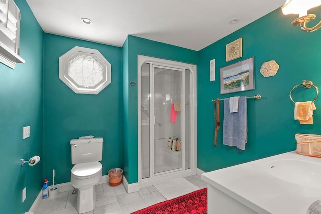181 Pleasant St, South Yarmouth, MA 02664 - bathroom with a stall shower, baseboards, toilet, and a sink