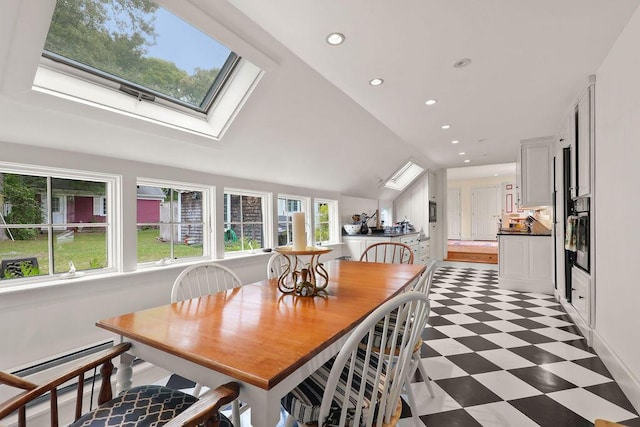181 Pleasant St, South Yarmouth, MA 02664 - dining space featuring light flooring, a skylight, recessed lighting, and vaulted ceiling