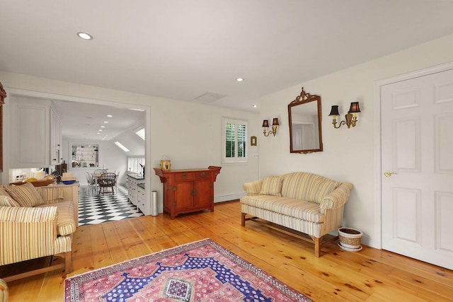 181 Pleasant St, South Yarmouth, MA 02664 - living room featuring light wood-style floors, a baseboard heating unit, and recessed lighting