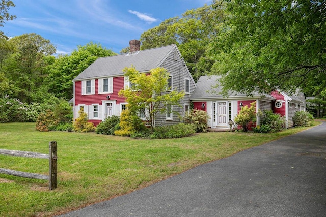 181 Pleasant St, South Yarmouth, MA 02664 - colonial home with a chimney, a front yard, and roof with shingles