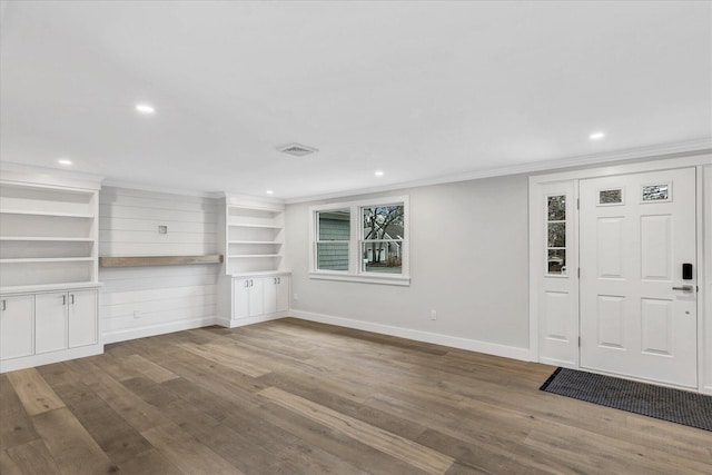 interior space featuring ornamental molding and hardwood / wood-style floors