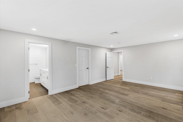 unfurnished room with light hardwood / wood-style floors