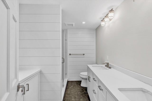 bathroom with vanity, an enclosed shower, tile patterned floors, and toilet