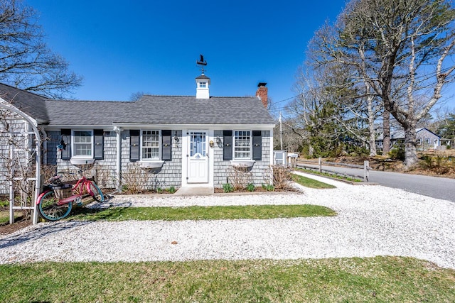 21 Nickerson Rd Unit 3, Cotuit, MA 02635 - view of front of house with a shingled roof and a chimney