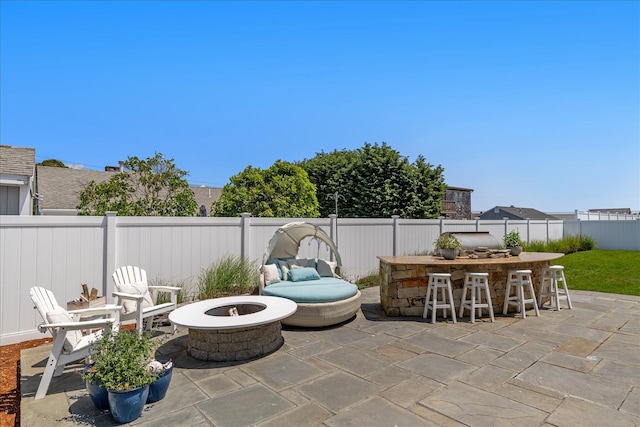 16 Beach View Rd, West Dennis, MA 02670 - fenced backyard with an outdoor fire pit and a patio area