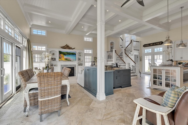 16 Beach View Rd, West Dennis, MA 02670 - dining area with beam ceiling, a towering ceiling, a high end fireplace, coffered ceiling, and ornate columns