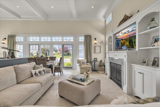 16 Beach View Rd, West Dennis, MA 02670 - living area with beam ceiling, a towering ceiling, a fireplace, and ornamental molding