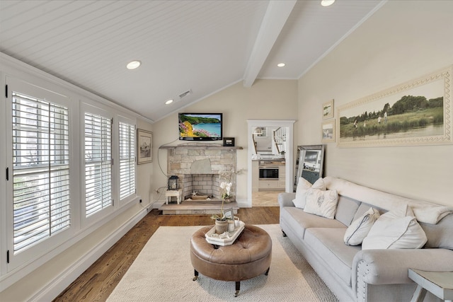 16 Beach View Rd, West Dennis, MA 02670 - living room featuring wood finished floors, a stone fireplace, baseboards, crown molding, and recessed lighting