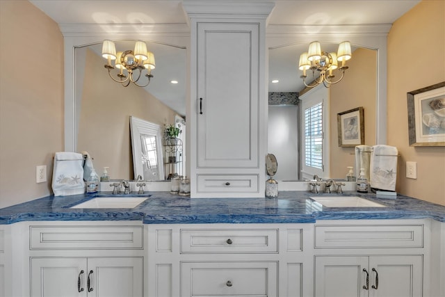 16 Beach View Rd, West Dennis, MA 02670 - bathroom with a chandelier and double vanity