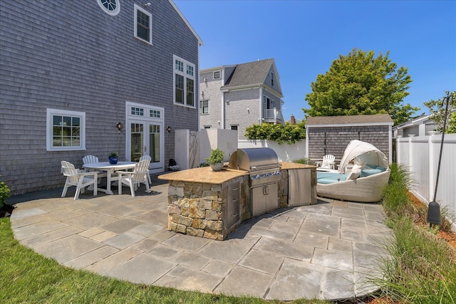 16 Beach View Rd, West Dennis, MA 02670 - fenced backyard with a patio area, outdoor dining area, and french doors