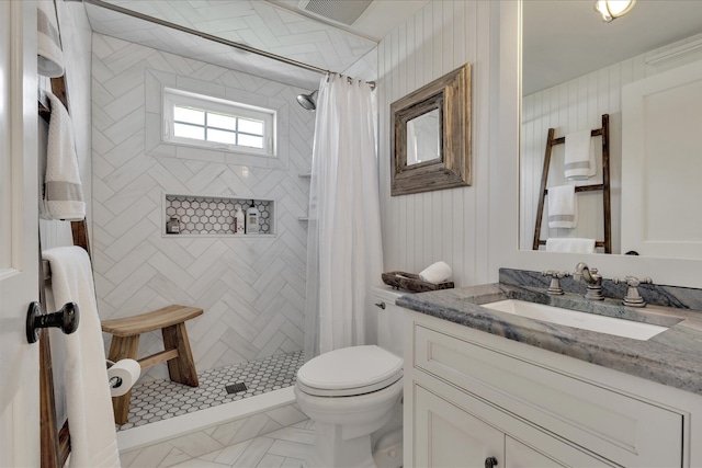 16 Beach View Rd, West Dennis, MA 02670 - full bathroom featuring vanity, toilet, and tiled shower