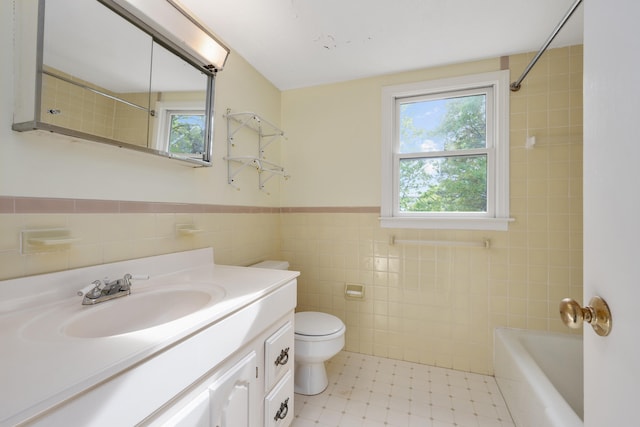 272 Sheep Pond Dr, Brewster, MA 02631 - full bath featuring tile walls, vanity, toilet, shower / bathtub combination, and wainscoting