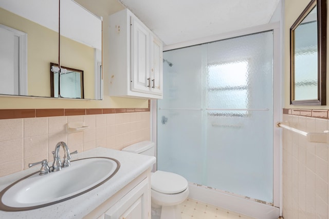 272 Sheep Pond Dr, Brewster, MA 02631 - bathroom featuring tile walls, toilet, a stall shower, and vanity
