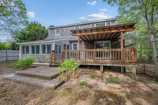 272 Sheep Pond Dr, Brewster, MA 02631 - rear view of property featuring a deck, a pergola, and a chimney