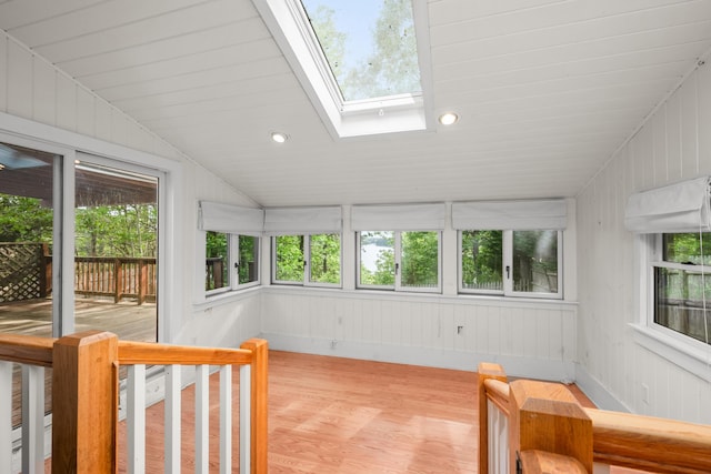 272 Sheep Pond Dr, Brewster, MA 02631 - sunroom / solarium featuring a skylight, a wooden deck, lofted ceiling, and wood finished floors