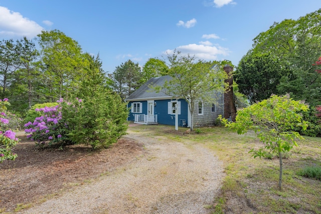 272 Sheep Pond Dr, Brewster, MA 02631 - view of front of property with dirt driveway and a chimney