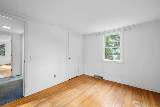 272 Sheep Pond Dr, Brewster, MA 02631 - unfurnished bedroom featuring light wood-style floors and a closet