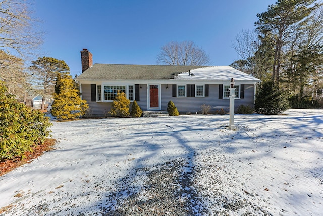 view of front of home featuring a chimney