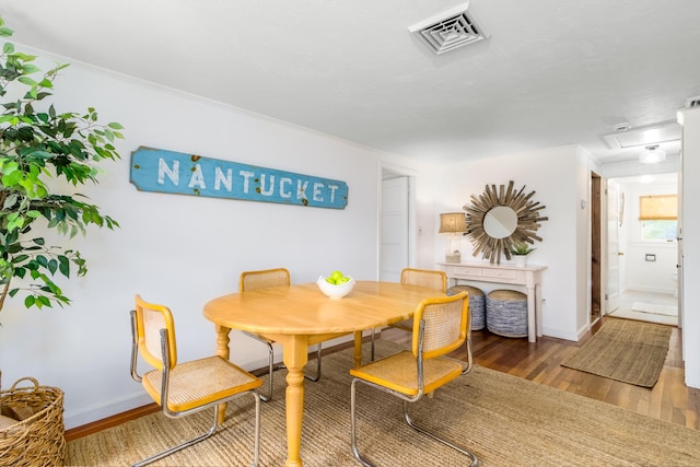 429 Paines Creek Rd, Brewster, MA 02631 - dining space featuring wood finished floors and crown molding