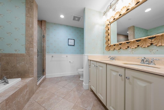 286 Grand Ave Unit 4U, Falmouth, MA 02540 - bathroom with double vanity, a shower stall, a garden tub, wainscoting, and tile patterned floors